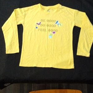 The color is yellow and is a very cute top for girls.